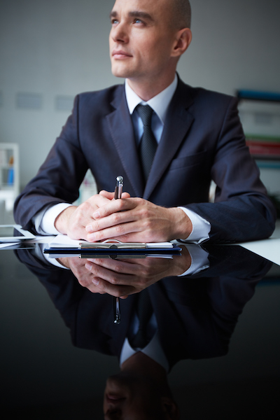 Image of pensive businessman at workplace